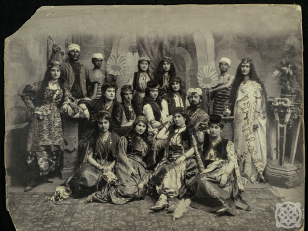 Preparations for the play "Haramkhana of Shalva Dadiani" 

Sitting: Naniko Marjanishvili, Lisa Chikovani, Sasha Chikovani, Jakeli woman; Standing on the left: Sonia Tketsishvili, on the right Kiknadze; Two unknown women are sitting, then Nina Lortkipanidze; Shah - Shalva Dadiani.