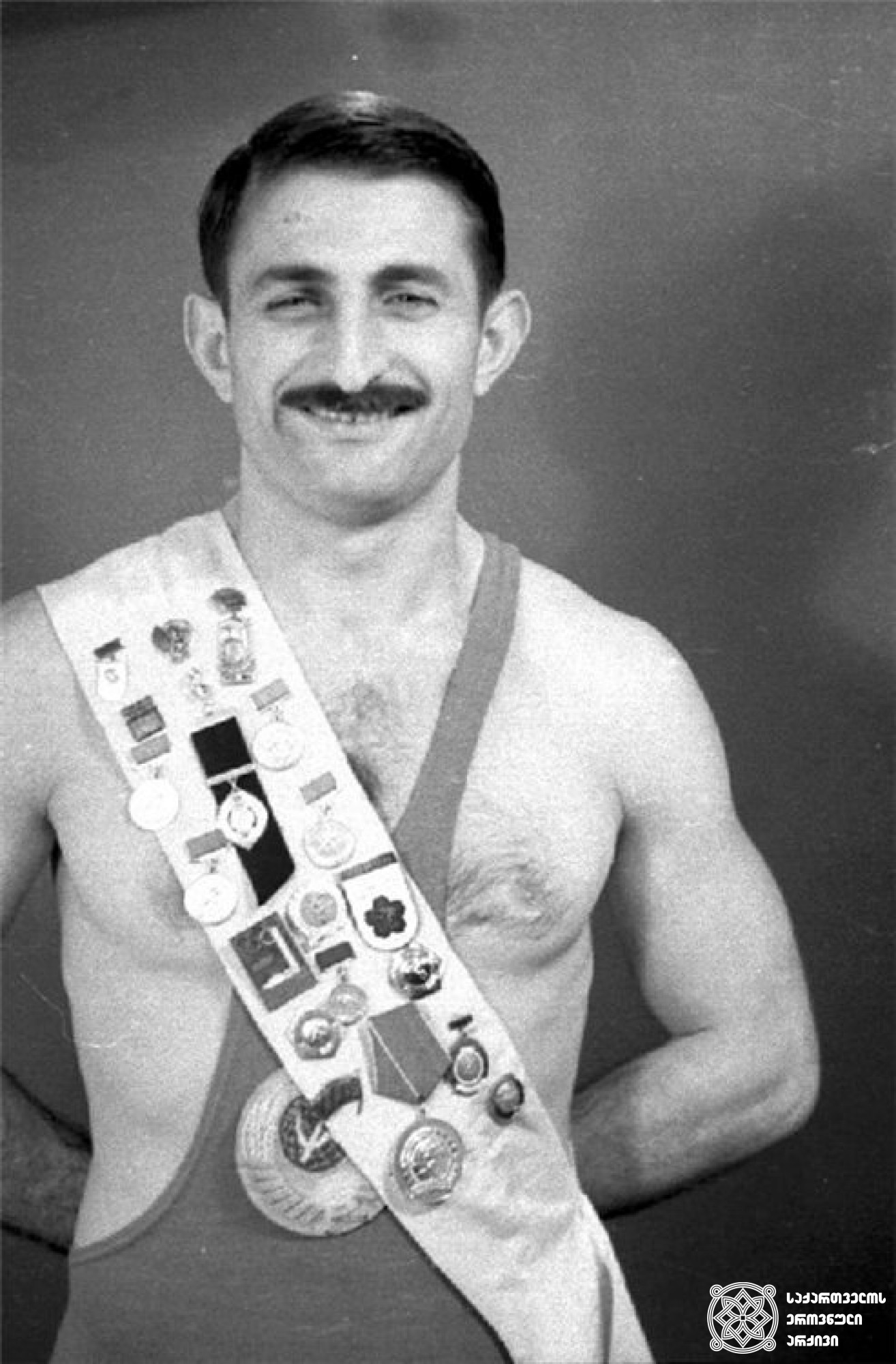 ვახტანგ ბალავაძე. <br>
XVI ოლიმპიური თამაშების მესამე პრიზიორი თავისუფალ ჭიდაობაში (1956 წელი, მელბურნი). 
Vakhtang Balavadze. <br>
Third-prize winner of the XVI Olympic Games in Wrestling Freestyle (1956, Melbourne).
