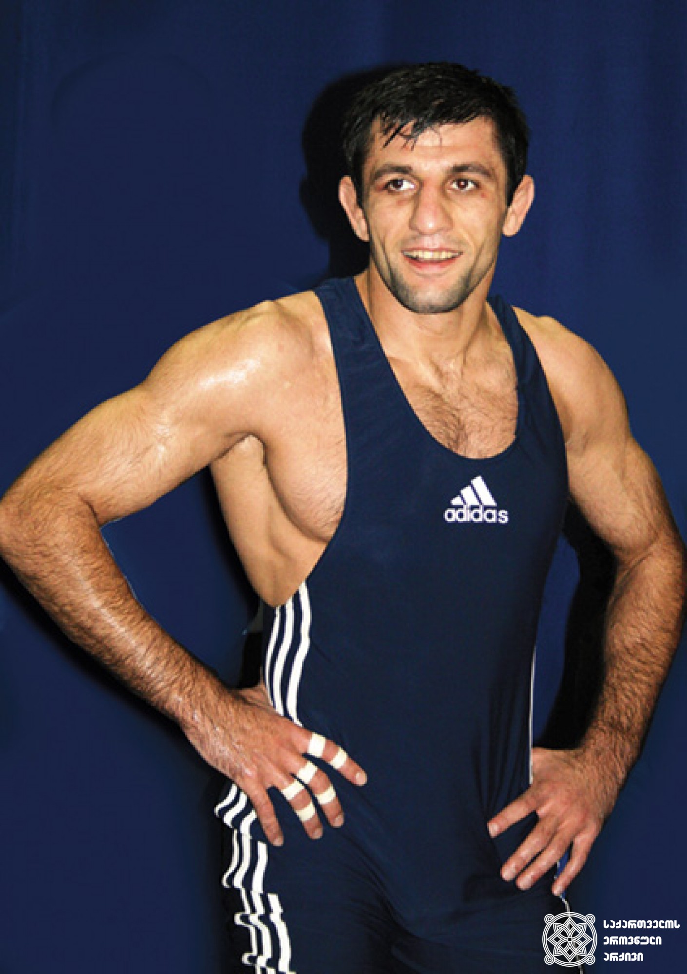 ოთარ თუშიშვილი. <br>
XXIX ოლიმპიური თამაშების მესამე პრიზიორი თავისუფალ ჭიდაობაში (2008 წელი, პეკინი). <br>
ფოტო საქართველოს ეროვნული ოლიმპიური კომიტეტის ვებგვერდიდან. <br>
Otar Tushishvili. <br>
Third-prize winner of the XXIX Olympic Games in Wrestling Freestyle (2008, Beijing). <br>
Photo from the web-site of the Georgian National Olympic Committee.